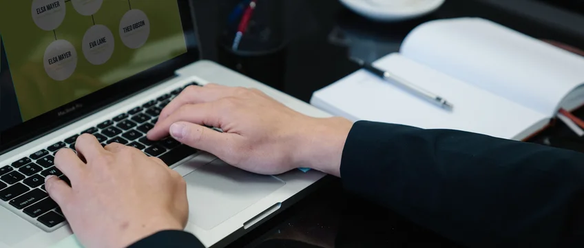 Professional completing an online certificate course on a laptop