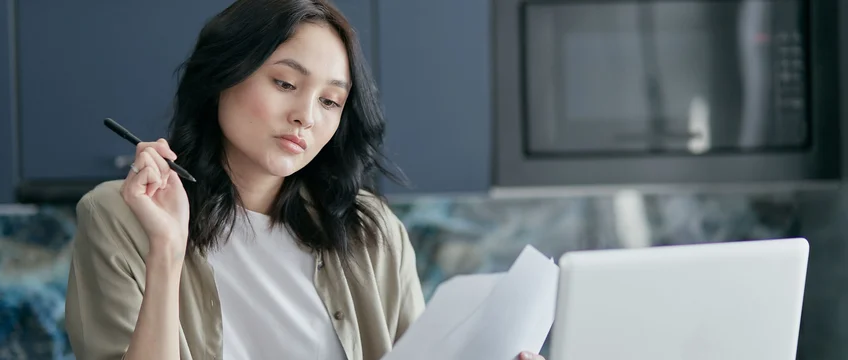 South African job seeker reviewing certificates and qualifications on a laptop