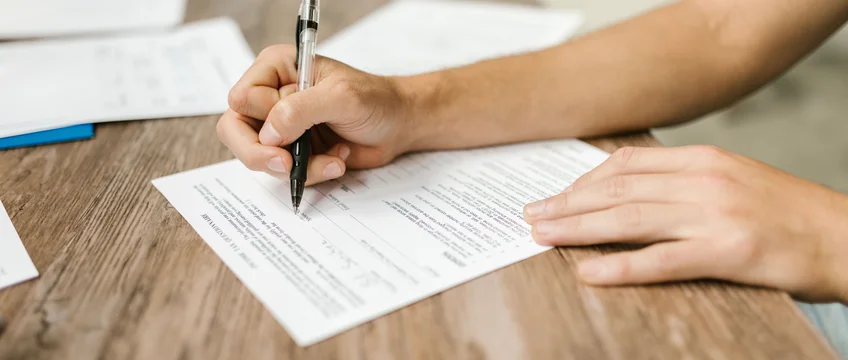 South African student filling in NSFAS funding application paperwork